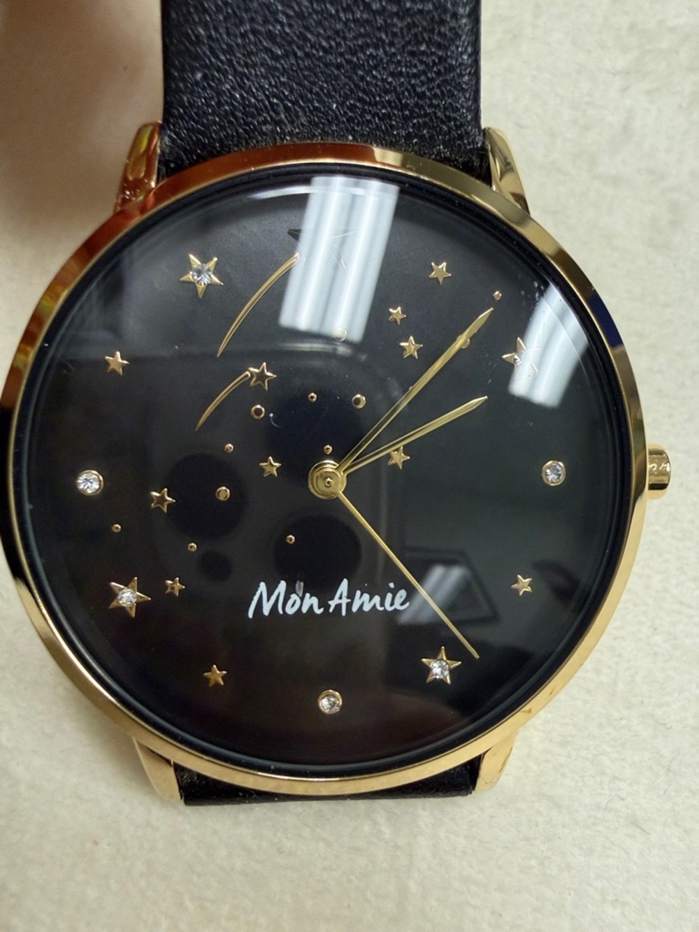 Women's Black Starburst Dial Watch with Gold Accents
